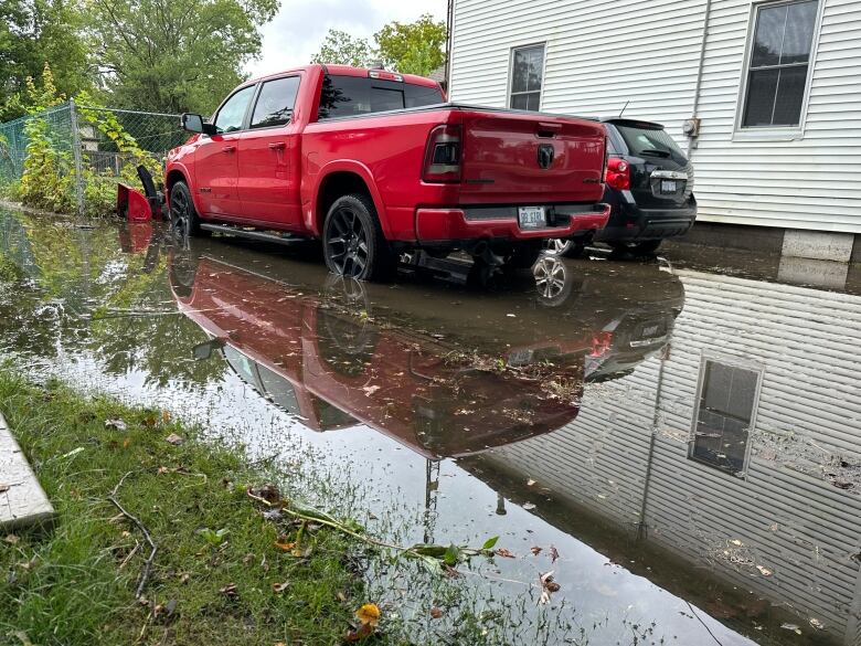 A Glencoe resident's pickup truck is surrounded by water as a result of flash flooding. 