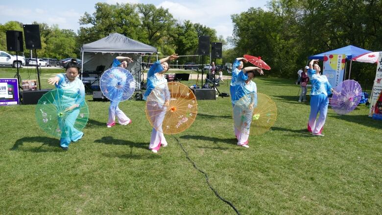 Dancers perform in a field