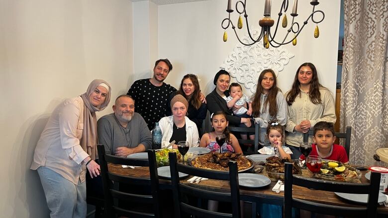 Family at a dinner table. 