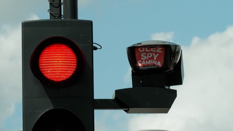 CBC news witnessed a protestor put a sticker over the lens of a camera meant to monitor and enforce the new ULEZ zone.   London police say they are investigation more than 300 acts of vandalism against cameras.