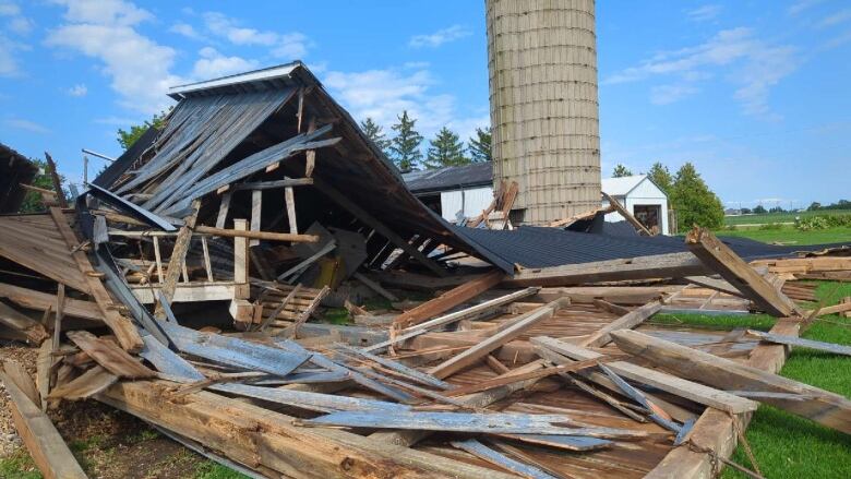 Barn with walls collapsed, Lakeshore Road 103. Barn was in fair condition, but nothing around it appeared to be damaged. Therefore, the 'expected' value of 155 km/h (SBO DOD6) was lowered somewhat toward the lower bound giving 145 km/h. Aug. 24, 2023.