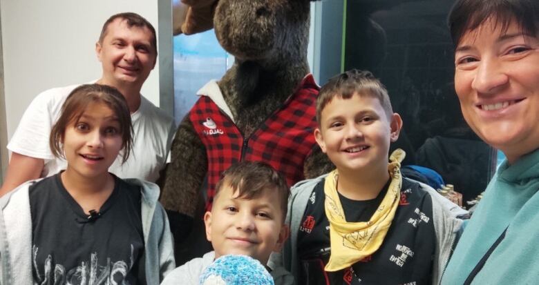 Oleksandr Maltsev and his family, pictured on their arrival in Calgary early in August.