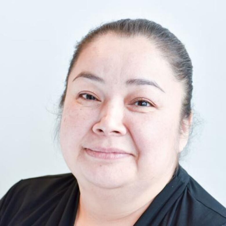 A headshot of a Cree woman in a black shirt.