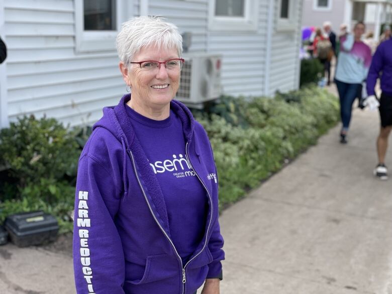 woman in purple sweatshirt