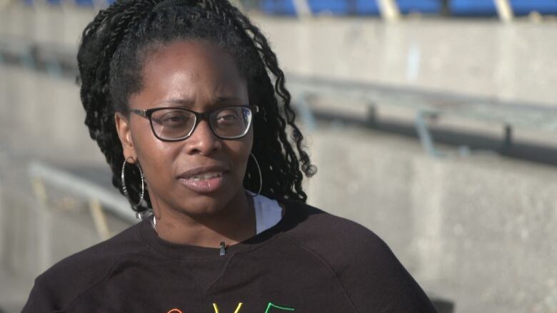 A picture of Tanya Hayles outdoors. She is the mother of a 10-year-old boy in Toronto and founder of the group Black Moms Connection