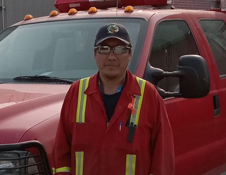 a man in front of a truck