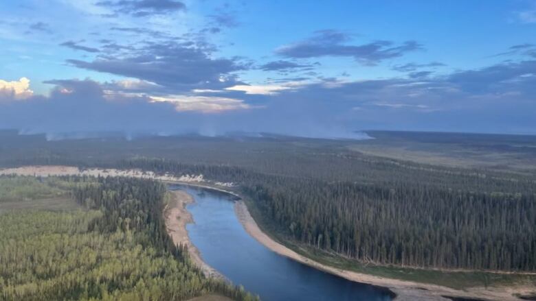 A river with smoke. 