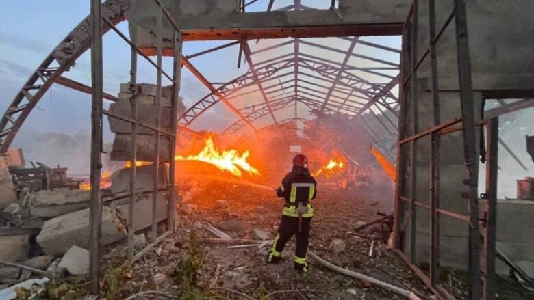 A structure burns after a drone strike in Odesa, Ukraine.