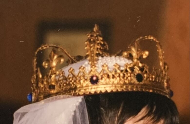 A gold crown with jewels.