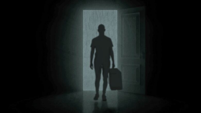 A female silhouette holds a suitcase in a doorway