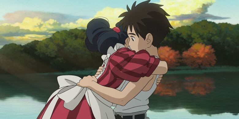 An animated boy and girl hug in front of a lake during autumn. The boy seems surprised, while the girl's face is obscured. 