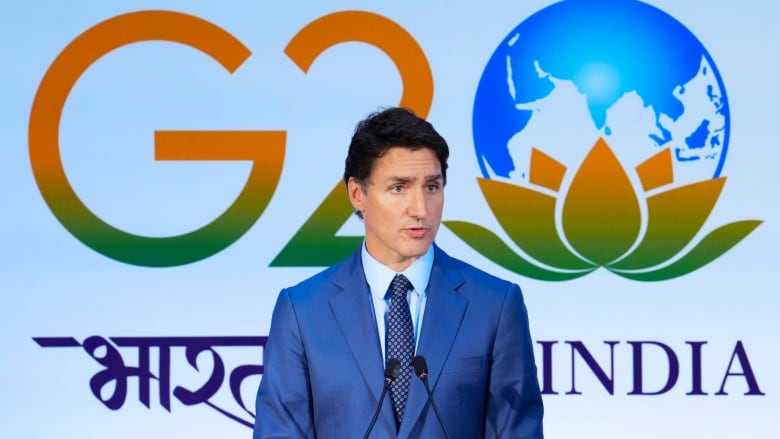 The Canadian prime minister speaks at the podium.