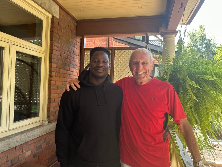 Hubert Campfens and Awofadeju Olajide Simon on the deck. 