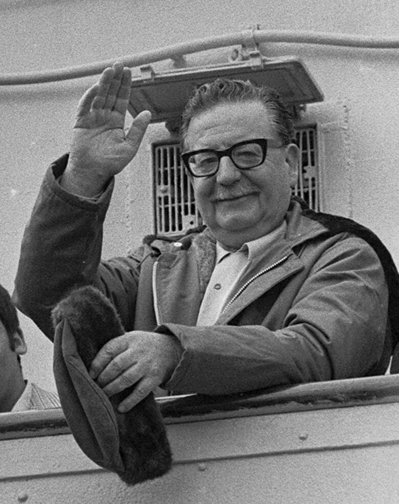 A man waves in a file photo.