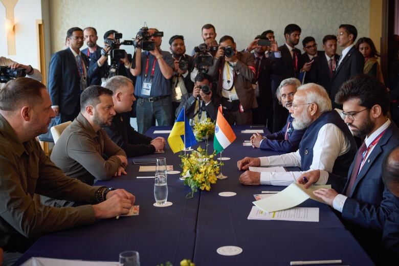 In this photo provided by the Ukrainian Presidential Press Office, Ukrainian President Volodymyr Zelenskyy (second left) and Indian Prime Minister Narendra Modi (second right) meet at the Grand Prince Hotel during the G7 Summit in Hiroshima, Japan on May 20, 2023.