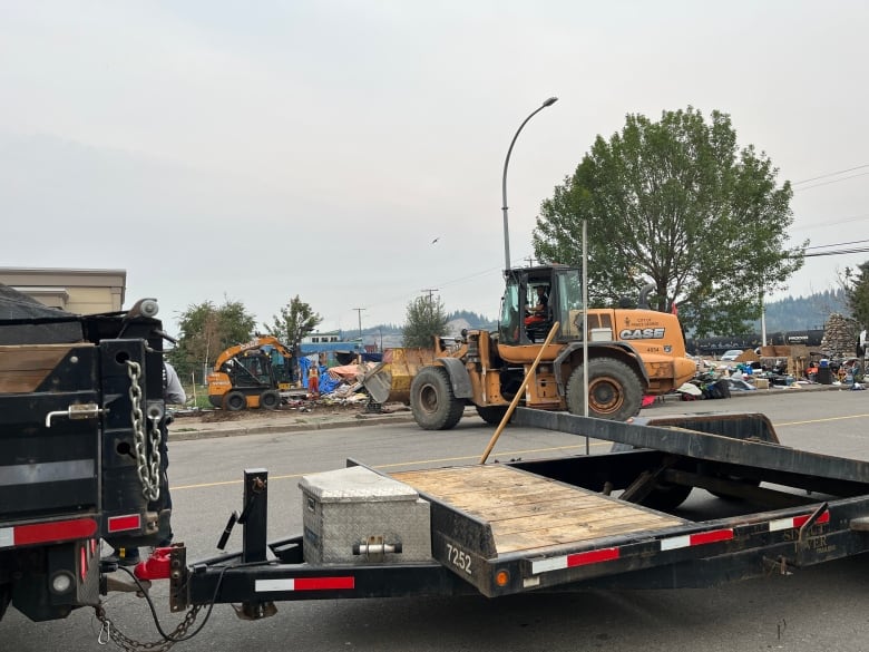 Heavy machinery at an encampment site