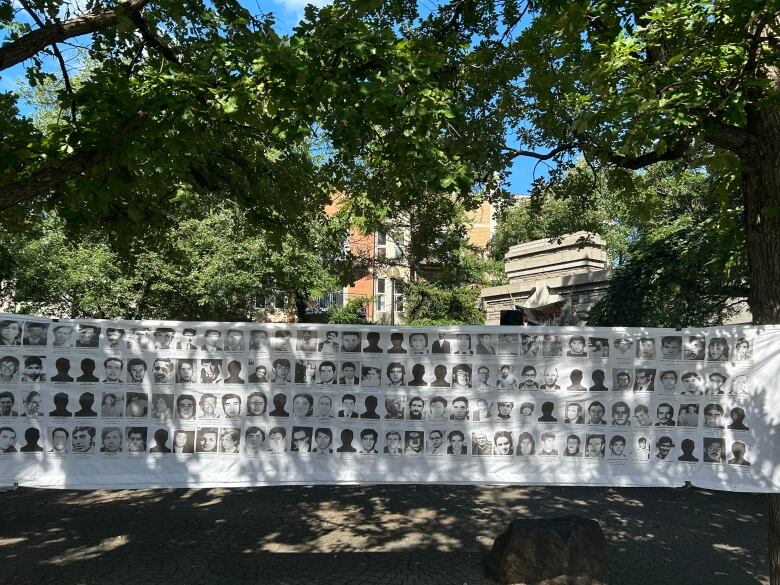 A banner showing the faces and names of a few of the thousands of people that were killed or made to disappear during the dictatorship hung in des Amrique park Monday. 