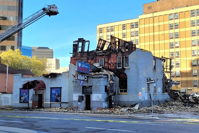 An exterior view of a brick building being demolished