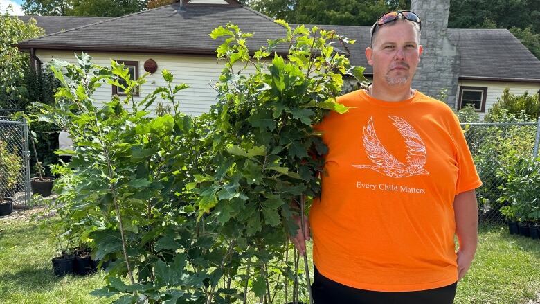 Robert Barber, 42, is one of the participants of the ORCHARD program who has found employment at Reforest London. He says he's learned lots of transferable skills to help him on the job.