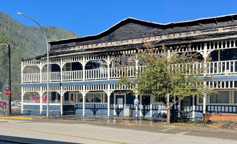 A hotel with a charred roof