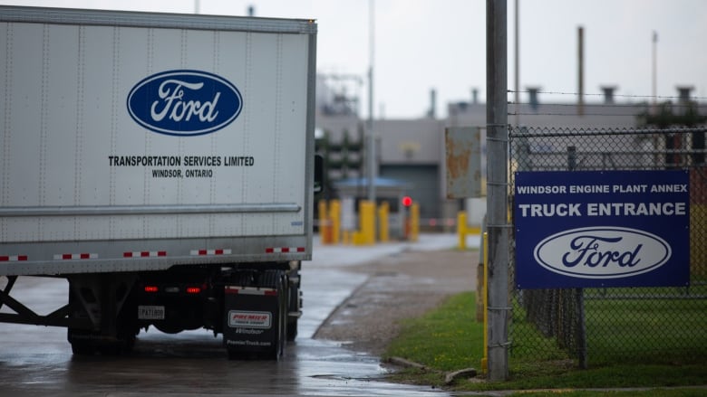 A transport truck turns into the Ford entrance way.