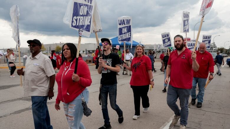 Striking United Auto Workers walk the picket line outside the Ford Michigan Assembly Plant in Wayne, Michigan, U.S. September 17, 2023.