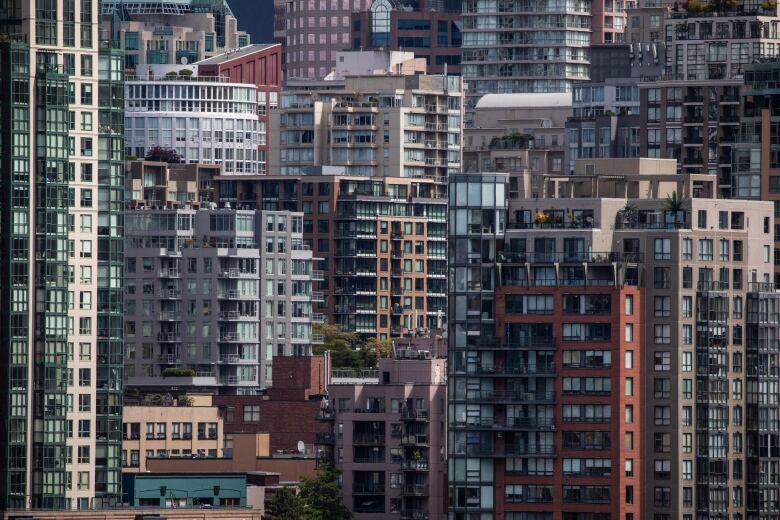 The downtown skyline is pictured from False Creek with storm clouds in Vancouver, British Columbia on Monday June 7, 2021.