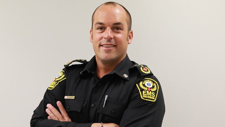 a head shot of a man in a paramedics uniform