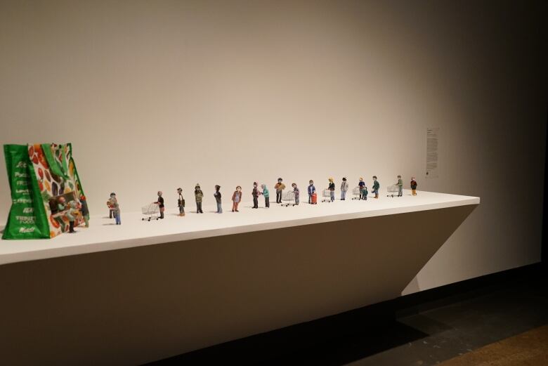 A row of mall figurines.