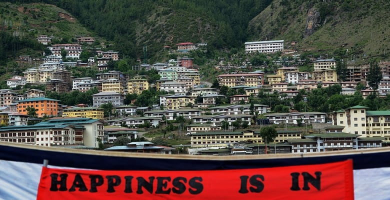 A banner making a reference to Gross National Happiness hangs in a field during a cultural event to celebrate the birth date of Bhutan's fourth king at a local school in Thimphu on June 2, 2013.