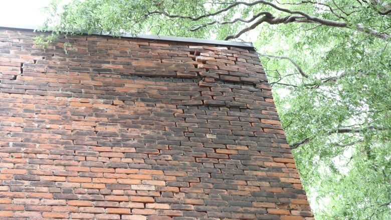 Bricks bulge from a corner at the top of the historic Tivoli theatre in Hamilton. 