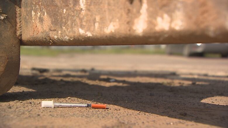 A discarded needle is seen near the emergency shelter in Charlottetown on Tuesday. 