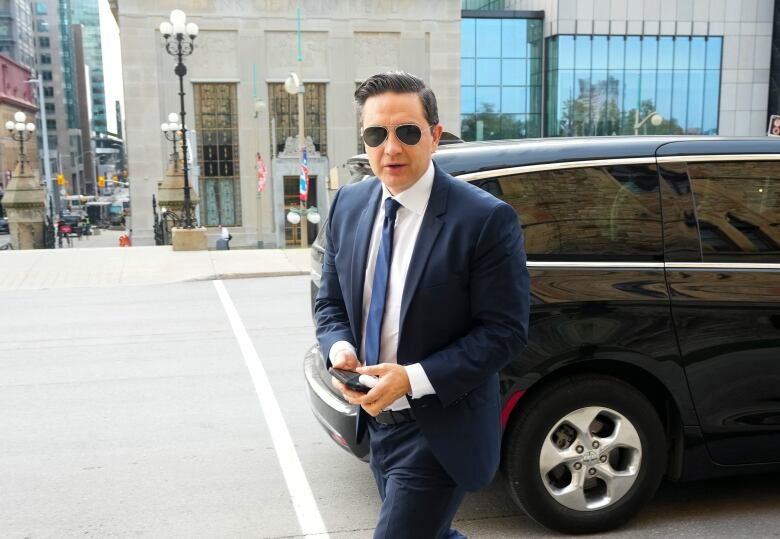 Conservative Leader Pierre Poilievre is seen entering West Block on Parliament Hill.