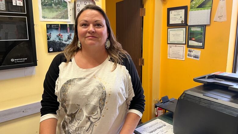 Dana Ferguson stands inside her hotel located in Fort Smith, N.W.T.