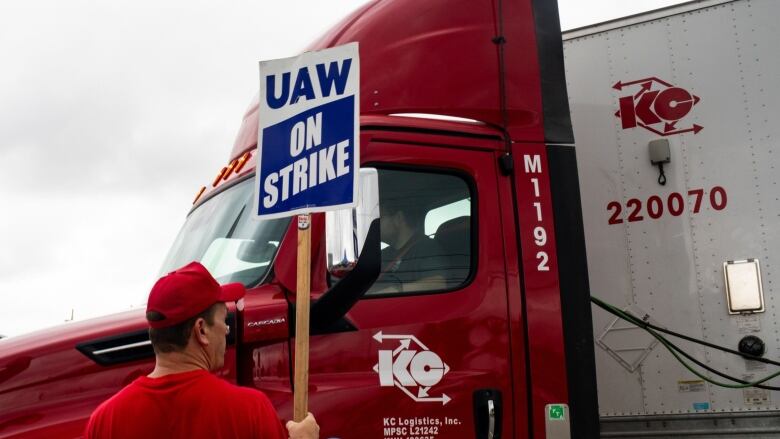 A picketer holds a 