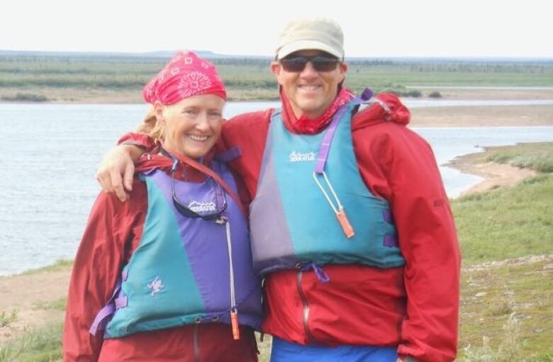 A man and a woman pose for a photo. 