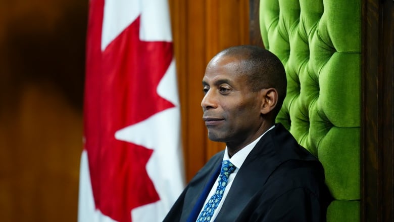 A legislature's speaker listens to question period.