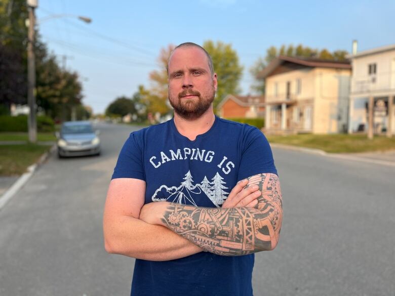 Homeowner Michael Girard-Courty stands in front of his house.