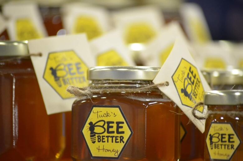 Jars of honey with Tuck's Better Bee Honey label