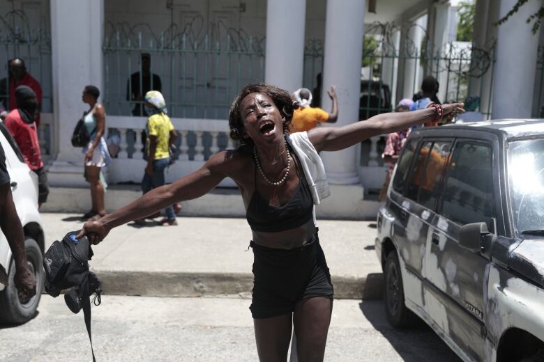 A woman screams about how her family members died at the hands of gang members in the Carrefour-Feuilles neighborhood during a protest against insecurity in Port-au-Prince, Haiti on Aug. 25, 2023.