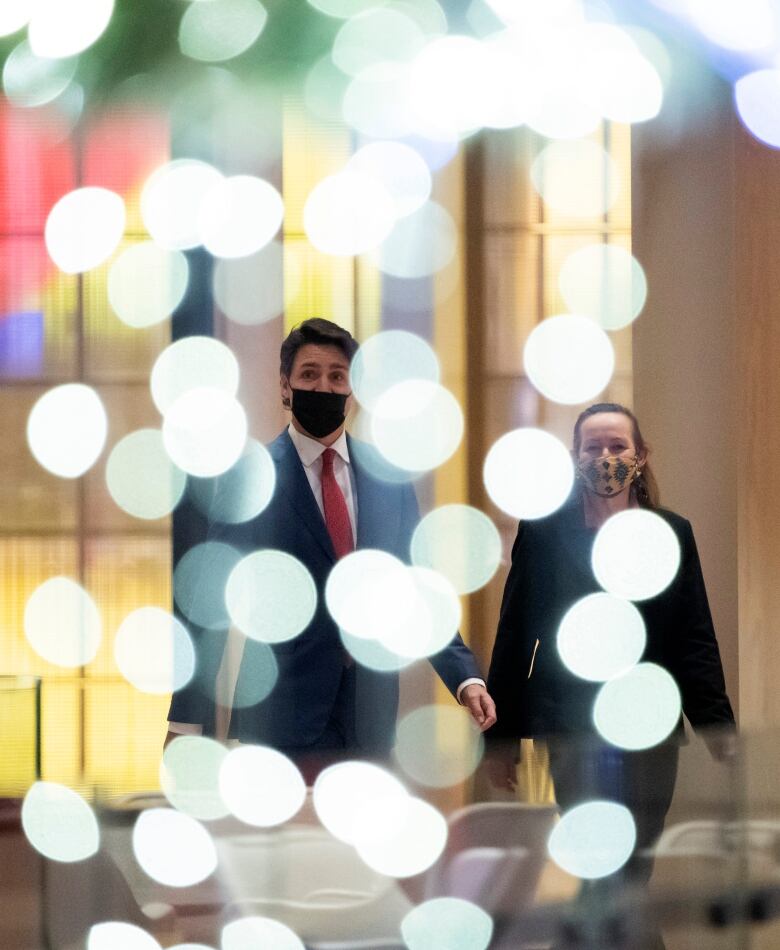 Prime Minister Justin Trudeau and Premier of the Northwest Territories Caroline Cochrane arrive for an announcement on early learning and child care, in Ottawa, on Dec. 15, 2021. 