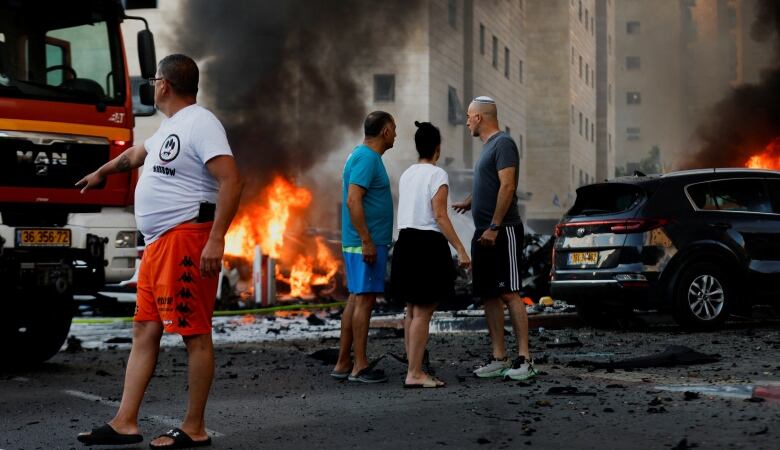 Fire from a rocket attack is seen in a residential area in Ashkelon, Israel.