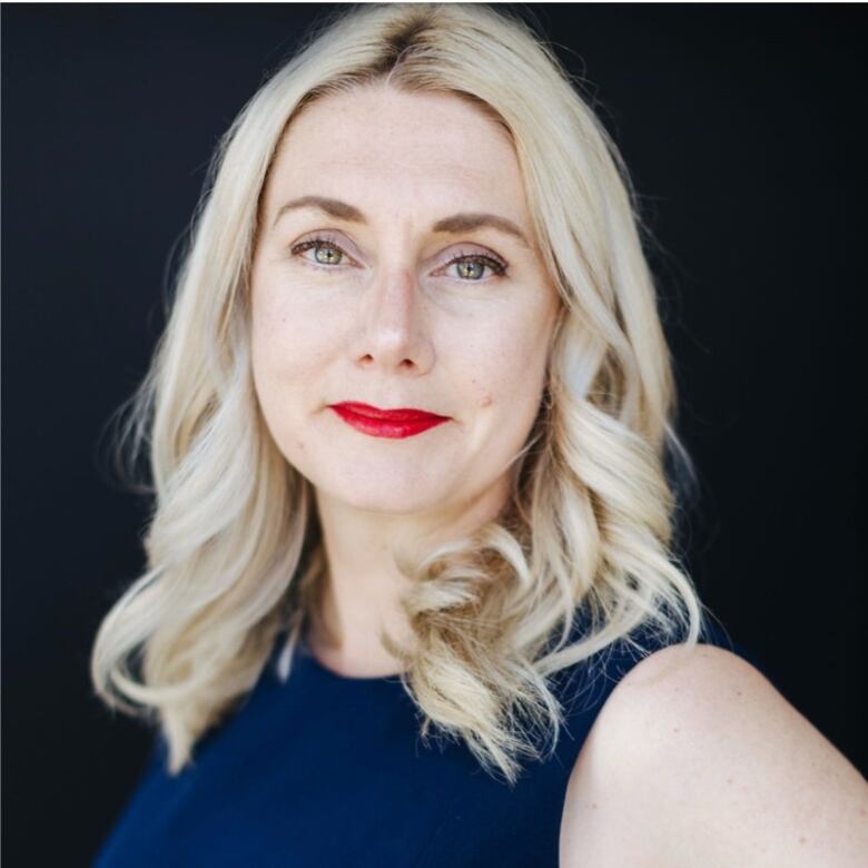 Portrait of a blonde woman wearing lipstick.