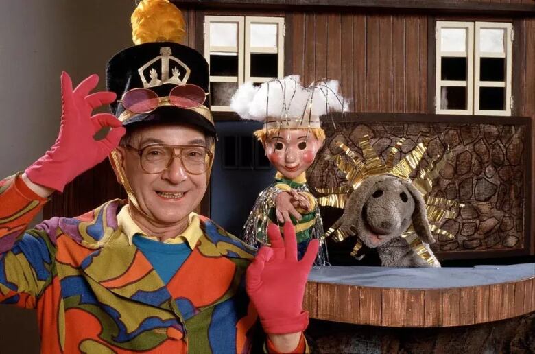 Mr. Dressup (Ernie Coombs) with puppets Casey and Finnegan in a still from the documentary Mr. Dressup: The Magic of Make-Believe.