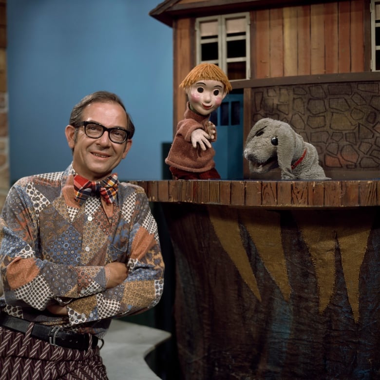 Mr. Dressup (Ernie Coombs) with puppets Casey and Finnegan in a still from the CBC series Mr. Dressup.