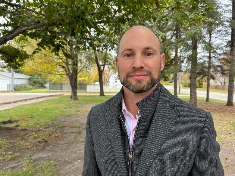 A bald man in a suit.