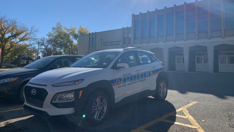 A school resource officer RPS car is parked at a Regina Catholic school.