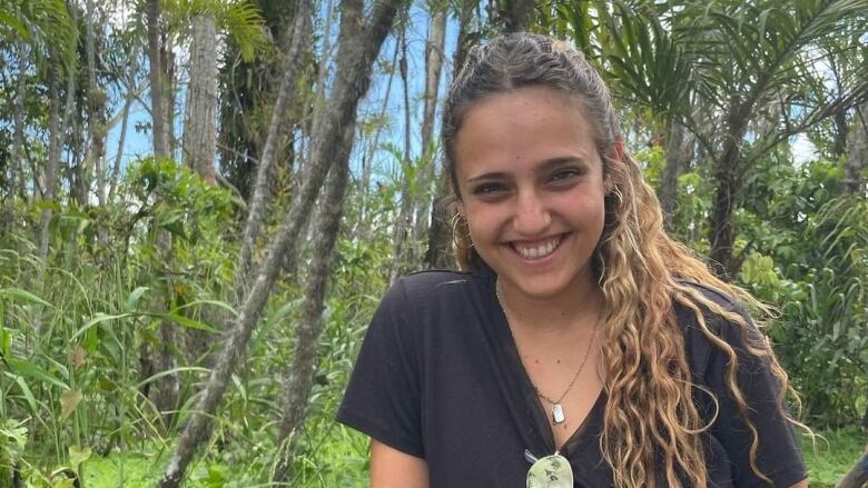 Romi Gonen, 23, was part of a group that tried to flee Hamas militants Saturday morning. She told her mother she had been shot in her hand and has not been in contact with her family since. 