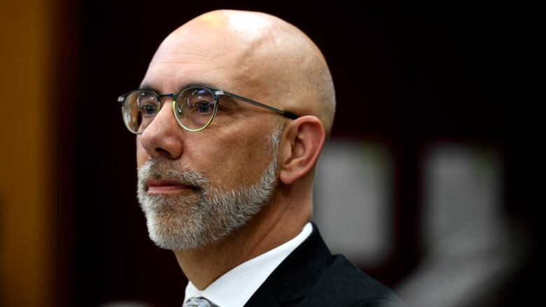 Parliamentary Budget Officer Yves Giroux prepares to appear before a committee in Ottawa, on Monday, June 13, 2022. The parliamentary budget officer says higher interest rates will lead the economy to stagnate in the second half of the year, while the federal deficit will rise significantly this fiscal year.