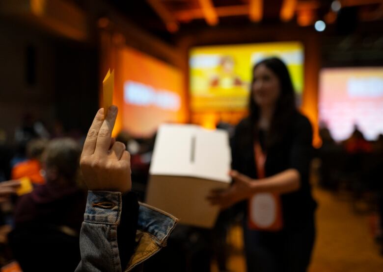 Delegates at the NDP Convention in Hamilton, Ont. cast their ballots in a vote to hold a leadership review or not, on Saturday, October 14, 2023.  THE CANADIAN PRESS/Peter Power